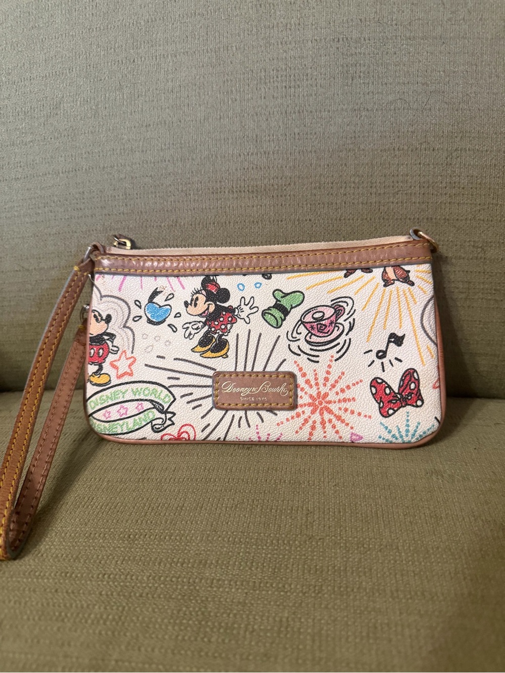 Disney Parks Sketch print wristlet by Dooney & Bourke